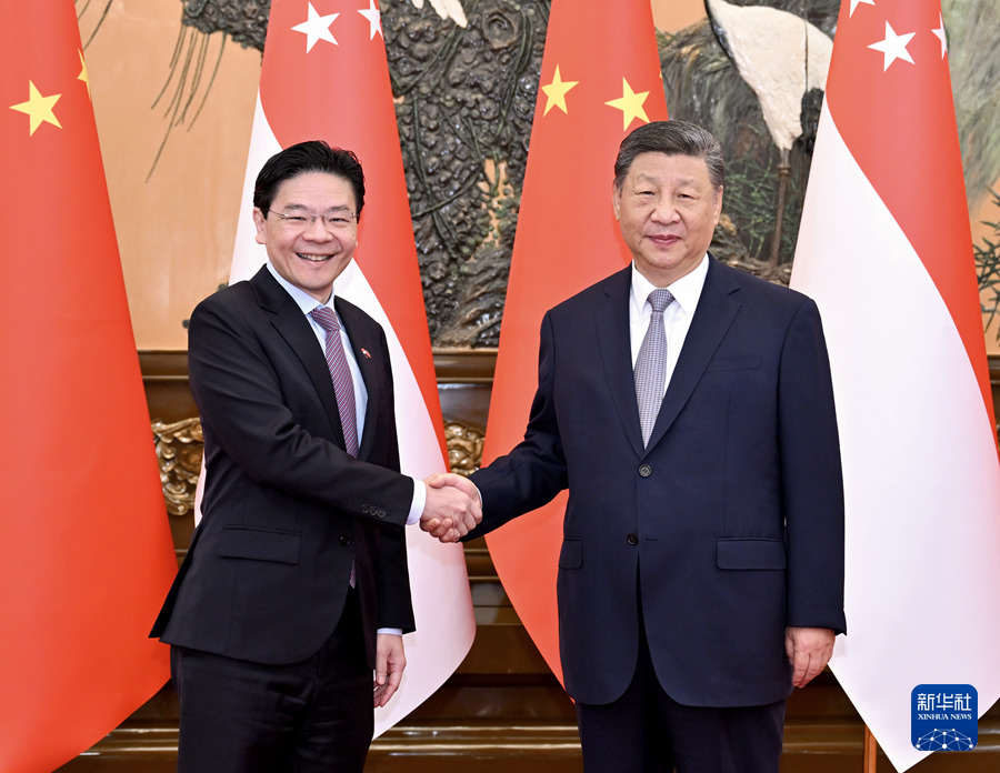 6月24日上午，國家主席習近平在北京人民大會堂會見來華進行正式訪問的新加坡總理黃循財。